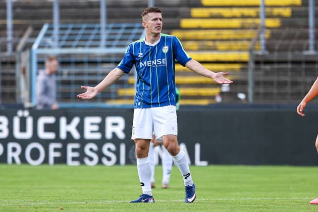 August 7, 2026, xkwix, Soccer, Regionalliga West, FC Gütersloh vs. VfL Bochum II, Heidewaldstadion, Matchday 2, 2026–2027 Season Aleksandar Kandic of FC Gütersloh 27 raises his arms DFB regulations prohibit any use of photographs as image sequences and or quasi-video Photo by xKamilxWilkowskixPressefotoKochx North Rhine-Westphalia, Germany