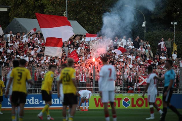 August 7, 2026, xsefx, Soccer, Borussia Dortmund II U23 vs. 1. FC Köln II U21, Regionalliga West, Rote Erde Stadium, Matchday 2, 2026–2027 season; 1. FC Köln II fans light flares in front of the teams. DFB regulations prohibit the use of photographs as image sequences and or quasi-video. North Rhine-Westphalia, Germany