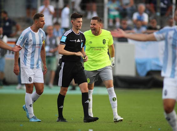 Soccer, Men s, Bavarian Regional League, 2026–2027 Season, TSV 1860 Munich vs. FC Augsburg II, Grünwalder Stadium; Vitus Eicher of TSV 1860 Munich is visibly upset after the 2–1 loss—shouting, screaming, emotional—here with referee Johannes Wagner on the left