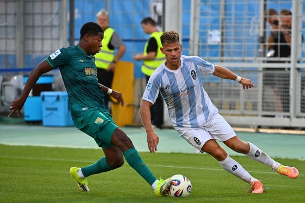Florian NIEDERLECHNER, TSV 1860 Munich, in action, tackling Junior Atemkeng A, Bavarian Regional Soccer League, 2026–2027 season,Matchday 26–27, Game 3: TSV 1860 Munich vs. FC Augsburg II, 2–2 on August 7, 2026, at Grünwalder Stadion in Munich
