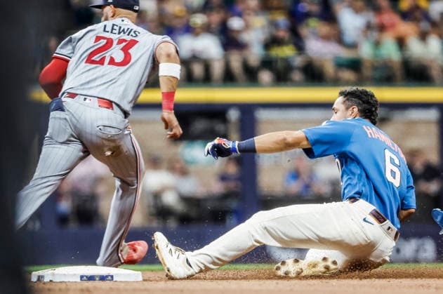 Milwaukee Brewers third baseman David Hamilton slides into second base with a double on Minnesota Twins second baseman Royce Lewis in the eighth inning of the MLB, Baseball Herren, USA game between the Minnesota Twins and the Milwaukee Brewers at American Family Field in Milwaukee, Wisconsin on Friday, August 7, 2026. The Twins defeated the Brewers 8-6.  MIL20260807844 TANNENxMAURY