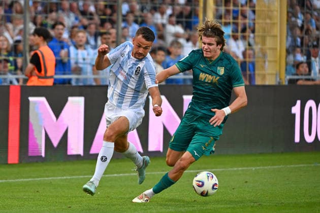 Raphael WACH, TSV 1860 Munich, Action, Tackle against David LICHTENSTEIGER A, Bavarian Regional League Soccer, 2026–2027 Season, Matchday 26–27, Game 3: TSV 1860 Munich vs. FC Augsburg II, 2–2 on August 7, 2026, at Grünwalder Stadium in Munich