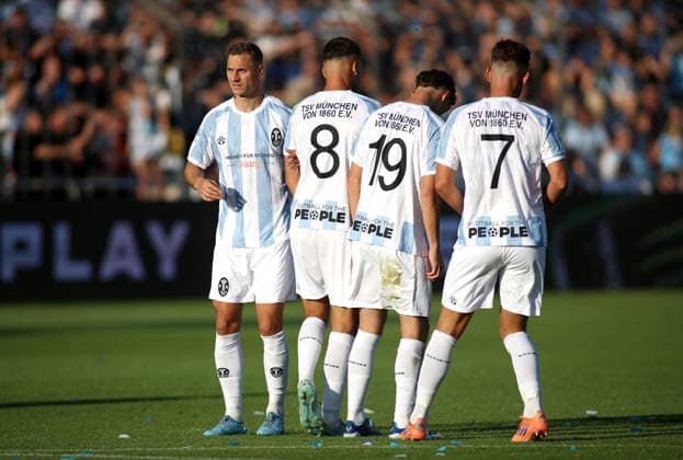 Soccer, Men s, Bavarian Regional League, 2026–2027 Season, TSV 1860 Munich vs. FC Augsburg II, Grünwalder Stadium: Dennis Dressel of TSV 1860 Munich forms the wall for a free kick here alongside Raphael Wach of TSV 1860 Munich, Emre Erdogan of TSV 1860 Munich, and Florian Niederlechner of TSV 1860 Munich