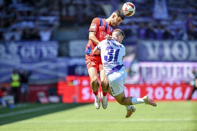 Oualid Mhamdi of 1 FC Heidenheim 1846 and Patrick Kammerbauer of VfL Osnabrück in a tackle during the 2. Bundesliga match between 1 FC Heidenheim and VfL Osnabrück, at the Voith Arena on August 8, 2026, in Heidenheim an der Brenz, Germany. Photo by Harry Langer, DeFodi Images. Oualid Mhamdi of 1 FC Heidenheim 1846 and Patrick Kammerbauer of VfL Osnabrück battle for the ball during the 2. Bundesliga match between 1 FC Heidenheim and VfL Osnabrück at Voith Arena on August 8, 2026 in Heidenheim an der Brenz, Germany Photo by Harry Langer, DeFodi Images. DFB and DFL regulations prohibit any use of photographs as image sequences and or quasi-video. Photo by Harry Langer, DeFodi Images. DFB and DFL regulations prohibit any use of photographs as imSEQUENCES AND OR QUASI-VIDEO