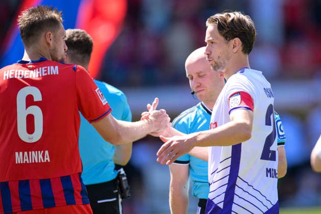 Soccer, 2. Bundesliga, 20260808, 1. FC Heidenheim vs. VfL Osnabrück. Pictured, from left: Patrick MAINKA (Heidenheim, 6), Jannik MÜLLER (Osnabrück, 24). Seating is unassigned at Heidenheim’s Voith Arena in Baden-Württemberg, Germany. Copyright: Passion2Press MarkusxFischerx