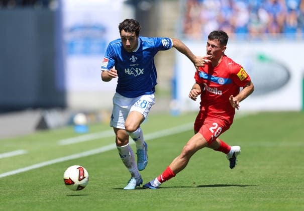 August 8, 2026, Soccer, 2. Bundesliga, SV Darmstadt 98 vs. Holstein Kiel, from left: Christopher Lannert (SV Darmstadt 98), Adrian Kapralik (Holstein Kiel). DFL and DFB regulations prohibit any use of photographs as image sequences and or quasi-video. xdcx Copyright: HMBxMedia Claus