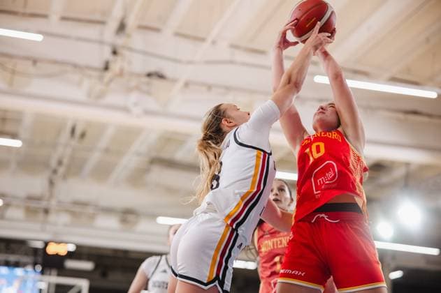 Anja Adzic (No. 10, Montenegro) battles for the ball in the air against a German player at Kistamässan in Stockholm. Another German player can be seen in the background. Anja Adzic (No. 10, Montenegro) battles for the ball against Germany. Copyright: xJoelxKruehlerx