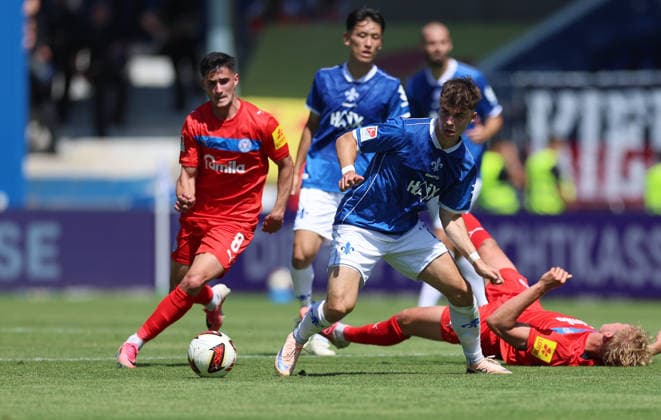 August 8, 2026, Soccer, 2. Bundesliga, SV Darmstadt 98 vs. Holstein Kiel, from left: Guillermo Balzi (Holstein Kiel), Noah Weißhaupt (SV Darmstadt 98). DFL and DFB regulations prohibit any use of photographs as image sequences and or quasi-video. xdcx Copyright: HMBxMedia Claus