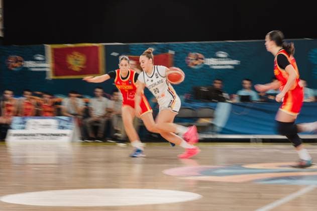 Sarah Siebold 20 of Germany drives the ball toward the basket and breaks through the defense of two Montenegrin players. The scene shows an intense one-on-one battle at the Kistamässan in Stockholm. Sarah Siebold 20 of Germany dribbles against Montenegro. Copyright: xJoelxKruehlerx