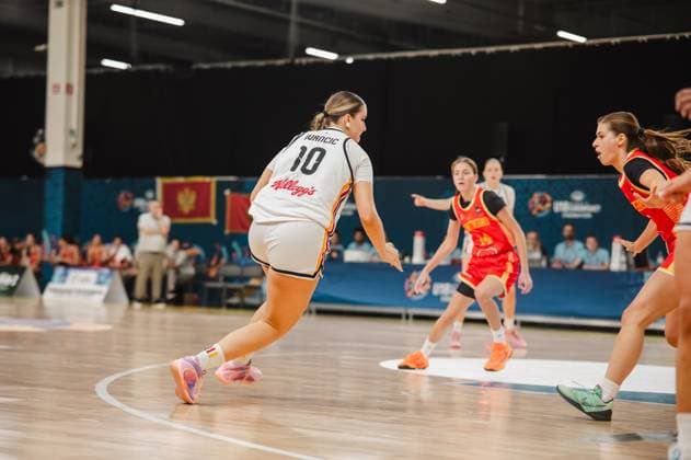 Diana Ivancic 10 of Germany drives the ball toward the basket while two Montenegrin players set up their defense. The scene takes place at Kistamässan in Stockholm. Diana Ivancic 10 of Germany on the offensive against Montenegro Copyright: xJoelxKruehlerx