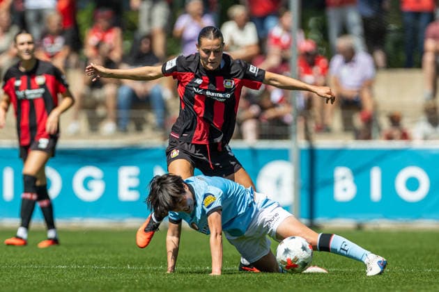 Carlotta Wamser of Bayer 04 Leverkusen and Kokona Iwasaki of Feyenoord Rotterdam battle for the ball during the preseason friendly match between the Bayer 04 Leverkusen women’s team and the Feyenoord Rotterdam women’s team at Ulrich Haberland Stadium on August 8, 2026, in Leverkusen, Germany. Photo by Mario Hommes, DeFodi Images. Carlotta Wamser of Bayer 04 Leverkusen and Kokona Iwasaki of Feyenoord Rotterdam battle for the ball during the preseason friendly match between Bayer 04 Leverkusen Women and Feyenoord Rotterdam Women at Ulrich Haberland Stadium on August 8, 2026 in Leverkusen, Germany Photo by Mario Hommes DeFodi Images