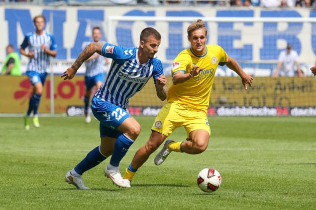 August 8, 2026, xgox, Soccer 2. Bundesliga 1 FC Magdeburg vs. Eintracht Braunschweig emspor, from left: Mateusz Zukowski (Magdeburg), 22, Lukas Frenkert, Braunschweig, 29, tackle, duel, battle, DFL DFB REGULATIONS PROHIBIT ANY USE OF PHOTOGRAPHS AS IMAGE SEQUENCES AND OR QUASI-VIDEO, Magdeburg
