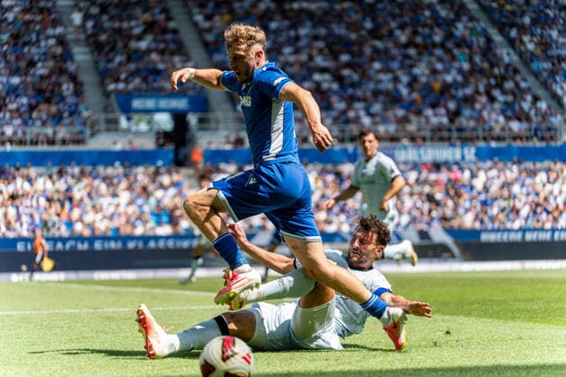 August 8, 2026, xdaymx, Soccer 2. Bundesliga, Karlsruher SC vs. Arminia Bielefeld, referee Bauer, Maximilian Bielefeld in a tackle with a hard slide tackle against Eichinger, Noel Karlsruhe DFL DFB REGULATIONS PROHIBIT ANY USE OF PHOTOGRAPHS as IMAGE SEQUENCES and or QUASI-VIDEO Karlsruhe
