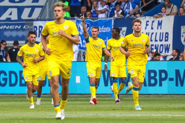 August 8, 2026, xgox, Soccer 2. Bundesliga: 1. FC Magdeburg vs. Eintracht Braunschweig (emspor), from left: Celebrations after Jan Urbich’s 0–3 goal for Braunschweig, 27 DFL and DFB regulations prohibit any use of photographs as image sequences and or quasi-video, Magdeburg
