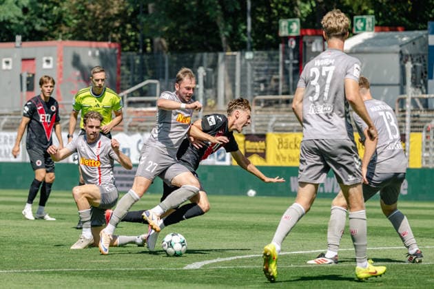Tackle between Lucas Hermes of SSV Jahn Regensburg, 27, and Niklas Swider of Viktoria Cologne, 20; FC Viktoria Cologne vs. SSV Jahn Regensburg, Soccer, 3. Liga, Matchday 1, 2026–2027 Season, August 8, 2026 DFL DFB regulations prohibit any use of photographs as image sequences and or quasi-video FC Viktoria Cologne vs. SSV Jahn Regensburg, soccer, 3rd Division, Matchday 1, 2026–2027 season, August 8, 2026, Cologne Copyright: xEibner-Pressefoto ThomasxHaeslerx EP_THR