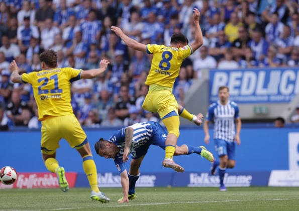 Mehmet Aydin, Eintracht Braunschweig; Baris Atik, 1 FC Magdeburg; Soccer, Men s, 2026–2027 Season, 2. Bundesliga, Avnet Arena, Matchday 1, 1 FC Magdeburg vs. Eintracht Braunschweig. DFL regulations prohibit any use of photographs as image sequences and or quasi-video.