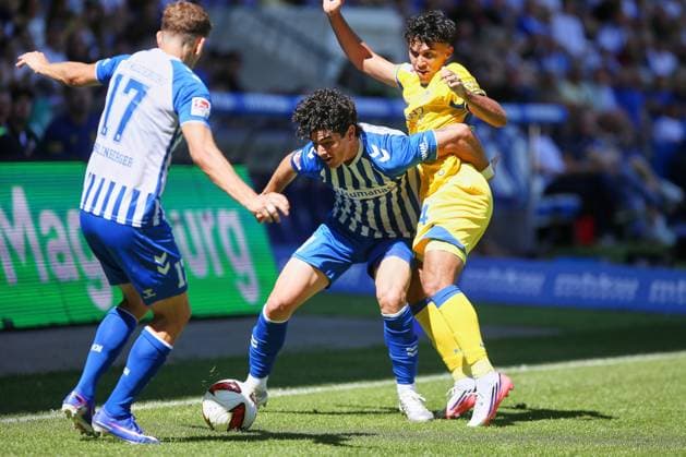 Magdeburg, Saxony-Anhalt, Germany, August 8, 2026, Avnet Arena, Matchday 1, 2026–27 Season, 2. Bundesliga, 1. FC Magdeburg vs. Eintracht Braunschweig, Anselmo Garcia MacNulty 3, 1 FC Magdeburg and Johan Gómez 44, Eintracht Braunschweig in a tackle; Alexander Nollenberger 17, 1 FC Magdeburg assists Copyright: xdtsxNachrichtenagenturx dts_129608