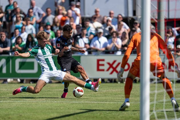 August 8, 2026, GER Germany, Soccer, 2026–2027 Season, Bundesliga, Friendly Match: Werder Bremen vs. SC Paderborn, Tackle between Oliver Batista Meier (SC Paderborn 07, No. 7) and Mick Schmetgens (SV Werder Bremen, No. 33), Karl Hein (SV Werder Bremen, No. 1), VfL Oythe Sports Complex, Vechta, Lower Saxony, Germany Copyright: xnordphotoxGmbHx xSchulzex