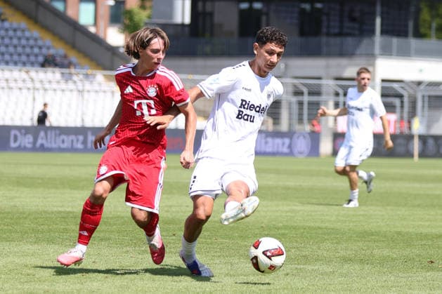 August 8, 2026, Men s Soccer, 2026–2027 Season, Bavarian Regional League, Matchday 3: FC Bayern Munich II vs. FC Schweinfurt 05. From left: Bohdan Olychenko (FC Bayern Munich II), 06, against Mustafa Alper Özden (FC Schweinfurt 05), 20. Munich, Municipal Stadium an der Grü, Bavaria, Germany