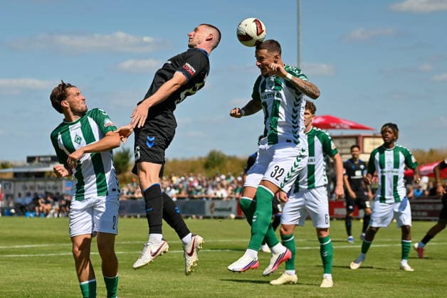 Marco Friedl (SV Werder Bremen), 32, in a header duel with Tjark Scheller (SC Paderborn), 25, and Olivier Deman (SV Werder Bremen), 02; SV Werder Bremen vs. SC Paderborn, soccer, friendly match, 2026–2027 season, August 8, 2026, SV Werder Bremen vs. SC Paderborn, soccer, friendly match, 2026–2027 season, August 8, 2026, Vechta Copyright: xEibner-Pressefoto RobertxGertzenx EP_RGN