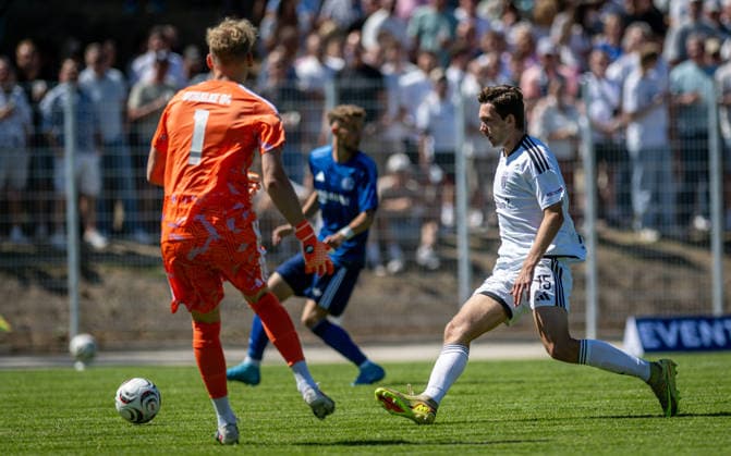 Soccer, 2026–2027 Season, Regionalliga West, August 8, 2026, Matchday 2, Men s, 1 FC Bocholt (white) vs. FC Schalke 04 U23 (blue) – Johannes Siebeking, goalkeeper for FC Schalke 04 U23; Lennar Garlipp, 1 FC Bocholt; Bocholt Stadion am Huenting, Germany 260808_fb_1fc-bocholt_schalke-04-u23_57488
