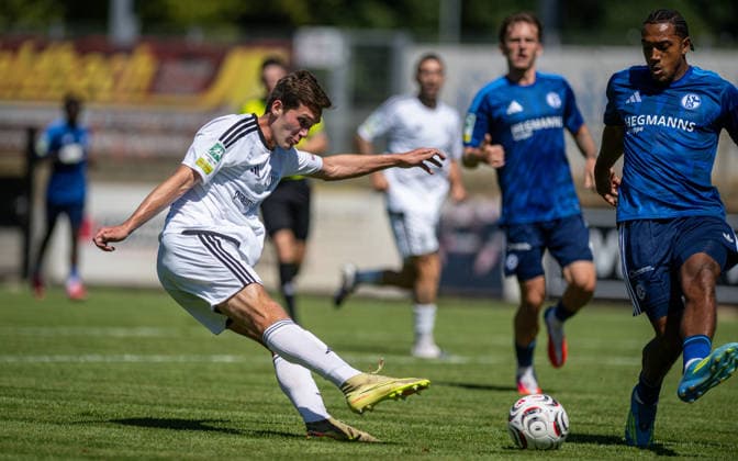 Soccer, 2026–2027 Season, Regionalliga West, August 8, 2026, Matchday 2, Men s, 1 FC Bocholt (white) vs. FC Schalke 04 U23 (blue) at Lennar Garlipp, 1 FC Bocholt, Anton Leander Donkor, FC Schalke 04 U23, Bocholt Stadion am Huenting, Germany 260808_fb_1fc-bocholt_schalke-04-u23_57493