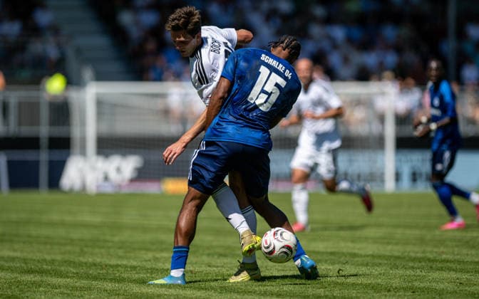 Soccer, 2026–2027 Season, Regionalliga West, August 8, 2026, Matchday 2, Men s, 1 FC Bocholt (white) vs. FC Schalke 04 U23 (blue) at Lennar Garlipp, 1 FC Bocholt, Anton Leander Donkor, FC Schalke 04 U23, Bocholt Stadion am Huenting, Germany 260808_fb_1fc-bocholt_schalke-04-u23_57503