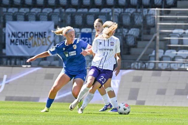 Soccer I Women s I 2026–2027 Season I Bundesliga I Matchday 2 I FC Carl Zeiss Jena vs. SGS Essen I August 8, 2026, Tackle by Anna Olmala 9, FC Carl Zeiss Jena, Kyra Spitzner 23, SGS Essen, Jena, Ernst Abbe Sportfeld, ad hoc Arena, Thuringia, Germany Copyright: xLobeca InesxHähnelx