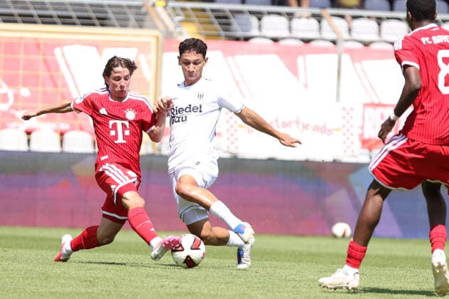 August 8, 2026, Men s Soccer, 2026–2027 Season, Bavarian Regional League, Matchday 3: FC Bayern Munich II vs. FC Schweinfurt 05. From left: Bohdan Olychenko (FC Bayern Munich II), 06, against Mustafa Alper Özden (FC Schweinfurt 05), 20. Munich, Städtisches Stadion an der Grü, Bavaria, Germany