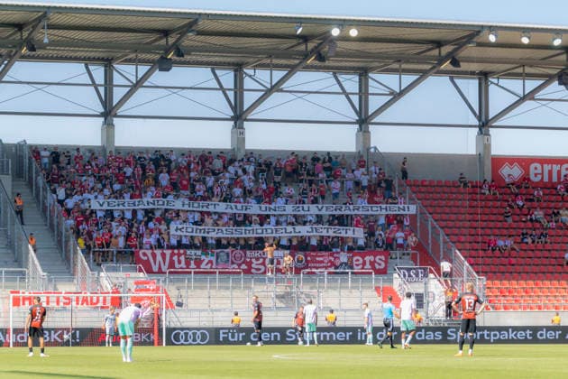 Ingolstadt, Germany, August 8, 2026, 3rd League 2026–2027, Matchday 1: FC Ingolstadt 04 vs. FC Würzburger Kickers. Pictured: Kickers fans in the visitors section holding a banner against the BFV. DFB and DFL regulations prohibit any use of photographs as image sequences and or quasi video at Audi Sportpark Bayern Copyright: xFotostandx xSchäferx