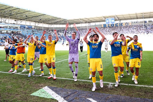 From left: Maximilian Entrup, Eintracht Braunschweig, 9; Tristan Wagner, Eintracht Braunschweig, 26; Jan Urbich, Eintracht Braunschweig, 27, Goalkeeper Ron Thorben Hoffmann, Eintracht Braunschweig, 1, Fabio Di Michele Sanchez, Eintracht Braunschweig, 22, Florian Flick, Eintracht Braunschweig, 6, Samuele Di Benedetto, Eintracht Braunschweig, 10 The Eintracht Braunschweig team celebrates in front of Fan Block 2 after the final whistle. 2026–2027 Bundesliga Season: 1. FC Magdeburg vs. Eintracht Braunschweig at the Avnet Arena in Magdeburg. Action,soccer, man, men, Germany, August 8, 2026
