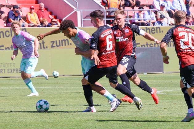 In a non-critical situation, Simon Lorenz of FC Ingolstadt 04, No. 32, and Georgios Antzoulas of FC Ingolstadt 04, No. 6, Namrud Embaye of Würzburger Kickers, No. 6, during the match between FC Ingolstadt 04 and Würzburger Kickers on August 8, 2026, DFB regulations prohibit any use of photographs as image sequences and or quasi-video. GER, Soccer, 3. Liga, Matchday 1, FC Ingolstadt 04 vs. Würzburger Kickers, August 8, 2026, Audi Sportpark Ingolstadt Copyright: xEibner-Pressefoto OliverxSTRISCHx EP-OSH