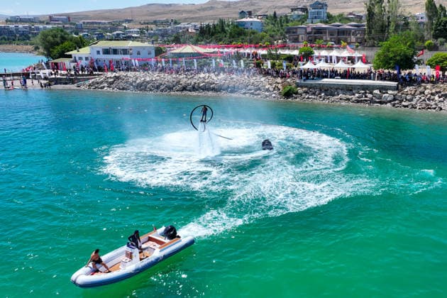12th Van Sea Water Sports Festival kicks off on Lake Van VAN, TURKIYE - AUGUST 08: A view of participants and athletes taking part in the 12th Van Sea Water Sports Festival held at the Edremit-Gebze Water Sports Center on the shores of Lake Van in Van, Turkiye, on August 08, 2026. Organized to promote Lake Van and boost local tourism, the two-day event features Beach volleyball, Beachvolleyball and handball matches, flyboard demonstrations, canoeing, rowing, dragon boat races, and various recreational activities. Ozkan Bilgin Anadolu Van Turkey. Editorial use only. Please get in touch for any other usage.  Copyright: x2026xAnadoluxOzkanxBilginx