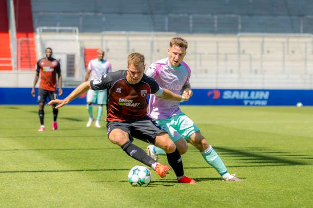 Ingolstadt, Germany, August 8, 2026, 3rd League 2026–2027, Matchday 1: FC Ingolstadt 04 vs. FC Würzburger Kickers. Pictured from left, in a tackle: Simon Lorenz (FCI) and Tim Kraus (FWK). DFB and DFL regulations prohibit any use of photographs as image sequences and or quasi-video Audi Sportpark Bayern Copyright: xFotostandx xSchäferx