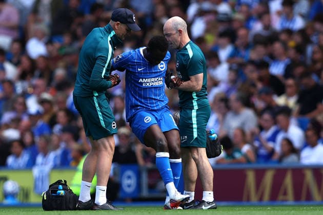 Brighton and Hove, England, 8th August 2026. Yankuba Minteh of Brighton & Hove Albion is helped up by medical staff after receiving medical treatment and then being substituted after picking up an injury during the Brighton and Hove Albion vs AS Roma Pre Season Friendly match at the AMEX Stadium, Brighton and Hove. Picture credit should read: Andrew Yates Sportimage EDITORIAL USE ONLY. No use with unauthorised audio, video, data, fixture lists, club league logos or live services. Online in-match use limited to 120 images, no video emulation. No use in betting, games or single club league player publications. SPI_007_PT_Brighton_Roma SPI-4897-0007