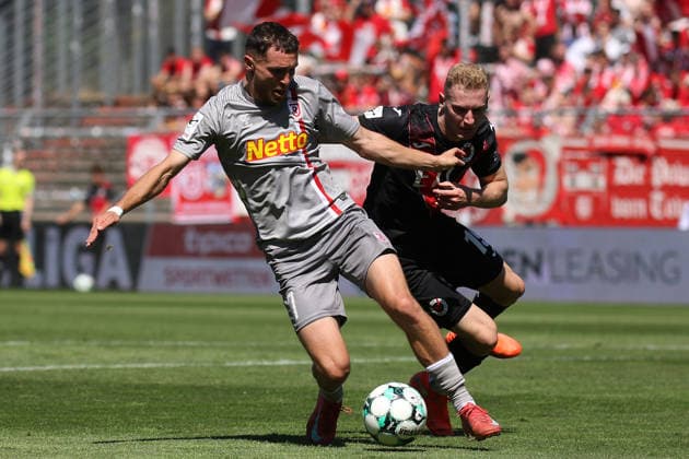 August 8, 2026, xsefx, Soccer, FC Viktoria Köln vs. SSV Jahn Regensburg, 3. Liga, Sportpark Höhenberg, Matchday 1, 2026–2027 Season: Niklas Castelle of FC Viktoria Köln (No. 44) in a tackle against Oscar Schönfelder of Jahn Regensburg (No. 07). DFB regulations prohibit any use of photographs as image sequences and or quasi-video. North Rhine-Westphalia, Germany