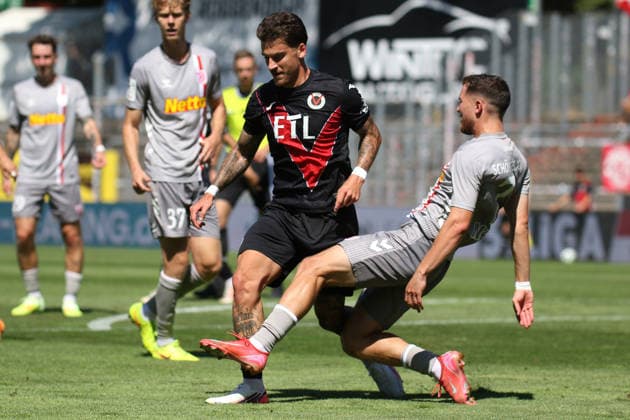 August 8, 2026, xsefx, Soccer, FC Viktoria Köln vs. SSV Jahn Regensburg, 3. Liga, Sportpark Höhenberg, Matchday 1, 2026–2027 Season: Niklas Castelle of FC Viktoria Köln (No. 44) in a tackle against Oscar Schönfelder of Jahn Regensburg (No. 07). DFB regulations prohibit any use of photographs as image sequences and or quasi-video. North Rhine-Westphalia, Germany