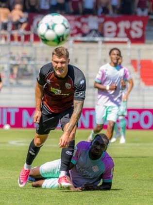 Ingolstadt, Germany, August 8, 2026, 3rd League 2026–2027, Matchday 1: FC Ingolstadt 04 vs. FC Würzburger Kickers. Pictured from left in a tackle: Jonas Scholz (FCI) and Tarsis Bonga (FWK). DFB and DFL regulations prohibit any use of photographs as image sequences and or quasi-video Audi Sportpark Bayern Copyright: xFotostandx xSchäferx