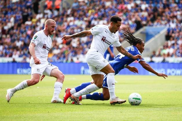 Bobby De Cordova-Reid of Leicester City is tackled by Elliott List of Northampton Town Leicester City v Northampton Town, EFL Carabao Cup, First Round, Football, King Power Stadium, Leicester, UK - 08 Aug 2026Leicester King Power Stadium United Kingdom EDITORIAL USE ONLY No use with unauthorised audio, video, data, fixture lists, club league logos or live services. Online in-match use limited to 120 images, no video emulation. No use in betting, games or single club league player publications.  Copyright: xMarkxKerton Shutterstockx 17051082cc