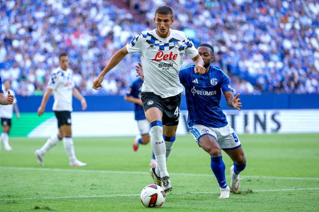August 8, 2026, Soccer, FC Schalke 04 vs. Atalanta Bergamo, Friendly Match, Veltins Arena, Gelsenkirchen, 2026–2027 season: Frederico Cassa of Atalanta Bergamo, No. 49, in a tackle against Moussa Sylla of FC Schalke 04. Note: DFB regulations prohibit any use of photographs as image sequences and or quasi-video. North Rhine-Westphalia, Germany