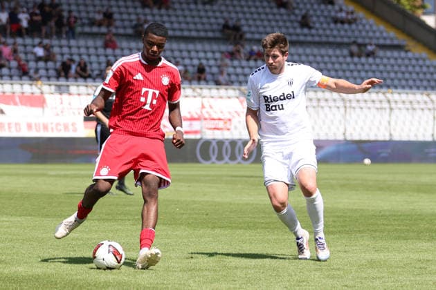 August 8, 2026, Men s Soccer, 2026–2027 Season, Bavarian Regional League, Matchday 3: FC Bayern Munich II vs. FC Schweinfurt 05. From left: Allen Junior Lambe (FC Bayern Munich II, No. 08) against Kevin Fery (FC Schweinfurt 05, No. 15). Munich, Städtisches Stadion an der Grü, Bavaria, Germany