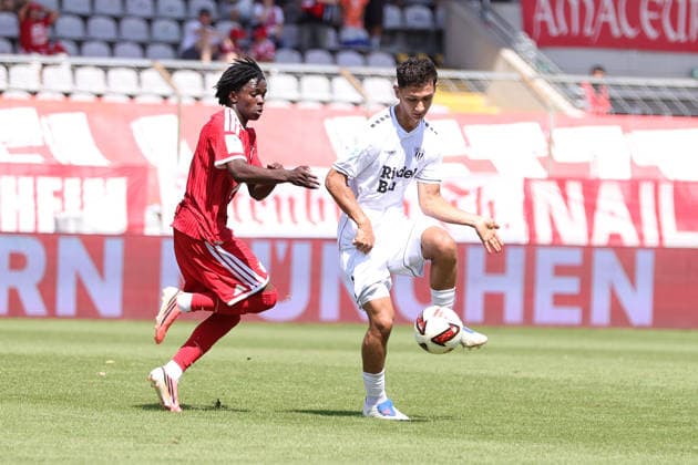 August 8, 2026, Men s Soccer, 2026–2027 Season, Bavarian Regional League, Matchday 3: FC Bayern Munich II vs. FC Schweinfurt 05. From left: Richard Ajayi (FC Bayern Munich II, No. 03) against Mustafa Alper Özden (FC Schweinfurt 05, No. 20). Munich, Städtisches Stadion an der Grü, Bavaria, Germany