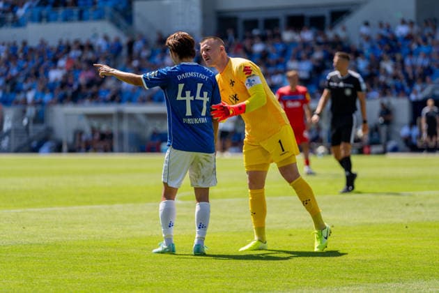 Game scene, gesture, body language; from left: Yosuke Furukawa (SV Darmstadt 98), No. 44, talking with Marcel Schuhen (SV Darmstadt 98), 01, GER, SV Darmstadt 98 vs. Holstein Kiel, soccer, 2. Bundesliga, Matchday 1, 2026–2027 season, August 8, 2026, DFL regulations prohibit any use of photographs as image sequences and or quasi-video, GER, SV Darmstadt 98 vs. Holstein Kiel, soccer, 2. Bundesliga, Matchday 1, 2026–2027 season, August 8, 2026, Darmstadt Copyright: xEibner-Pressefoto J-NxGroemlingx EP_JGG