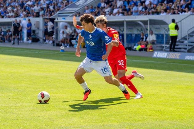 Game action, tackle, dribbling, offensive play, from left: Manolo Merx (SV Darmstadt 98, 48), Hiroki Sekine (Holstein Kiel, 32), GER, SV Darmstadt 98 vs. Holstein Kiel, soccer, 2. Bundesliga, Matchday 1, 2026–2027 season, August 8, 2026, DFL regulations prohibit any use of photographs as image sequences and or quasi-video, GER, SV Darmstadt 98 vs. Holstein Kiel, soccer, 2. Bundesliga, Matchday 1, 2026–2027 season, August 8, 2026, Darmstadt Copyright: xEibner-Pressefoto J-NxGroemlingx EP_JGG