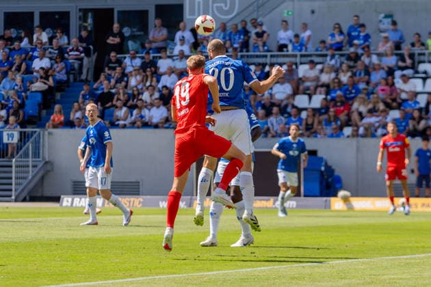 Match action: Aleksandar Vukotic (SV Darmstadt 98), 20, clears the ball with a header in front of Phil Harre (Holstein Kiel), 19, GER, SV Darmstadt 98 vs. Holstein Kiel, soccer, 2. Bundesliga, Matchday 1, 2026–2027 season, August 8, 2026, DFL regulations prohibit any use of photographs as image sequences and or quasi-video, GER, SV Darmstadt 98 vs. Holstein Kiel, soccer, 2. Bundesliga, Matchday 1, 2026–2027 Season, August 8, 2026, Darmstadt Copyright: xEibner-Pressefoto J-NxGroemlingx EP_JGG