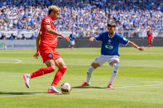 Game action, tackle, pass, passing play: Hiroki Sekine (Holstein Kiel, 32) vs. Ibrahim El Kadiri (SV Darmstadt 98, 11), GER, SV Darmstadt 98 vs. Holstein Kiel, soccer, 2. Bundesliga, Matchday 1, 2026–2027 season, August 8, 2026, DFL regulations prohibit any use of photographs as image sequences and or quasi-video, GER, SV Darmstadt 98 vs. Holstein Kiel, soccer, 2. Bundesliga, Matchday 1, 2026–2027 season, August 8, 2026, Darmstadt Copyright: xEibner-Pressefoto J-NxGroemlingx EP_JGG