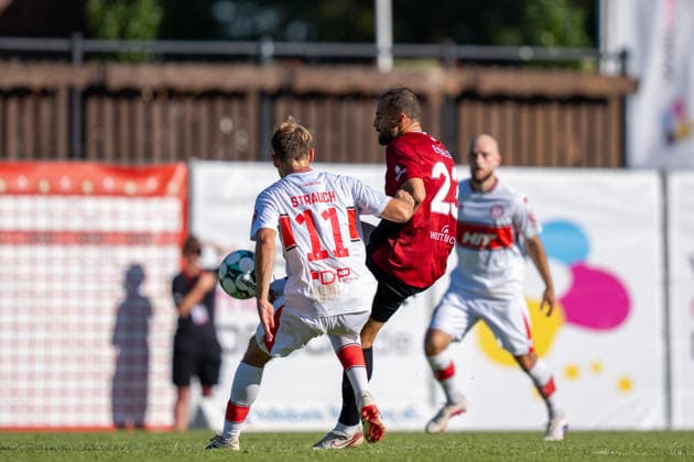 Fabian Eisele (SG Sonnenhof Großaspach, No. 23) in a tackle with Georg Strauch (Fortuna Köln, No. 11), SG Sonnenhof Großaspach vs. Fortuna Köln, soccer, 3rd Division, Matchday 1, August 8, 2026, DFB regulations prohibit any use of photographs as image sequences and or quasi-video. Aspach, Baden-Württemberg, Germany Copyright: xkolbert-press PhilipxZieglerx