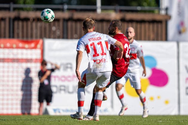 Fabian Eisele (SG Sonnenhof Großaspach, No. 23) in a tackle with Georg Strauch (Fortuna Köln, No. 11), SG Sonnenhof Großaspach vs. Fortuna Köln, Soccer, 3rd Division, Matchday 1, August 8, 2026, DFB regulations prohibit any use of photographs as image sequences and or quasi-video. Aspach, Baden-Württemberg, Germany Copyright: xkolbert-press PhilipxZieglerx