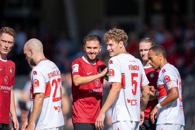 Volkan Celiktas (SG Sonnenhof Großaspach, 05) in conversation with Seymour Funger (Fortuna Köln, 05), SG Sonnenhof Großaspach vs. Fortuna Köln, soccer, 3rd Division, Matchday 1, August 8, 2026, DFB regulations prohibit any use of photographs as image sequences and or quasi-video. Aspach, Baden-Württemberg, Germany Copyright: xkolbert-press PhilipxZieglerx