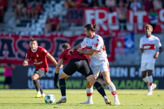 Fabian Eisele (SG Sonnenhof Großaspach, No. 23) in a tackle with David Haider (Fortuna Köln, No. 15), SG Sonnenhof Großaspach vs. Fortuna Köln, Soccer, 3rd Division, Matchday 1, August 8, 2026, DFB regulations prohibit any use of photographs as image sequences and or quasi-video. Aspach, Baden-Württemberg, Germany Copyright: xkolbert-press PhilipxZieglerx